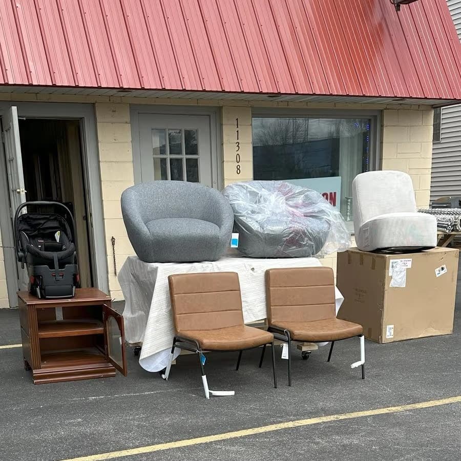 Out The Box Premium Bin Store storefront at 11308 W Greenfield Ave, West Allis WI — furniture and home goods displayed outside
